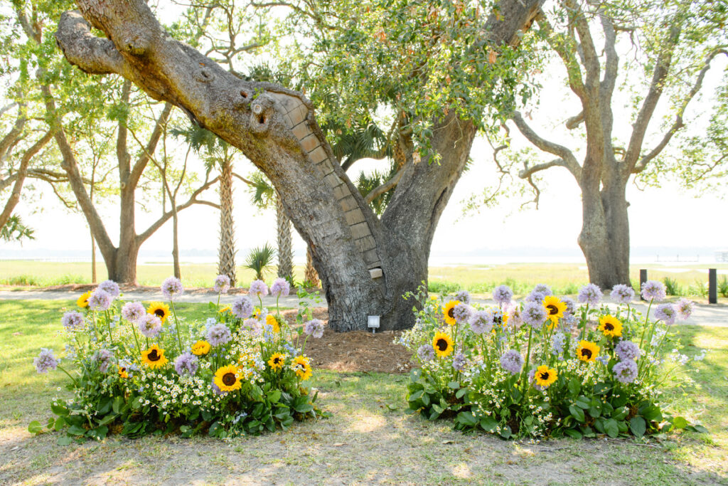 Lowndes Grove wedding flower alter with sunflowers and purple flowers