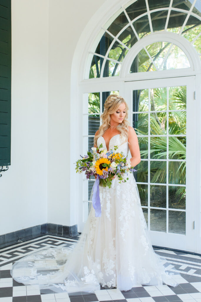 Lowndes Grove wedding bridal sunflower bouquet in atrium