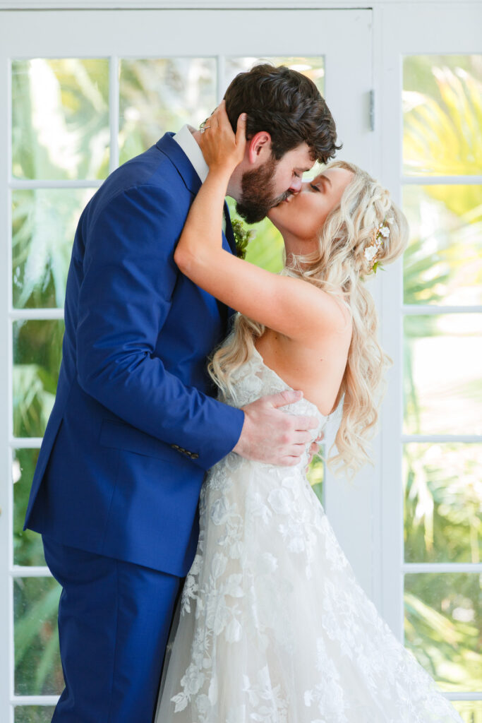 Lowndes Grove wedding bride and groom kiss in atrium