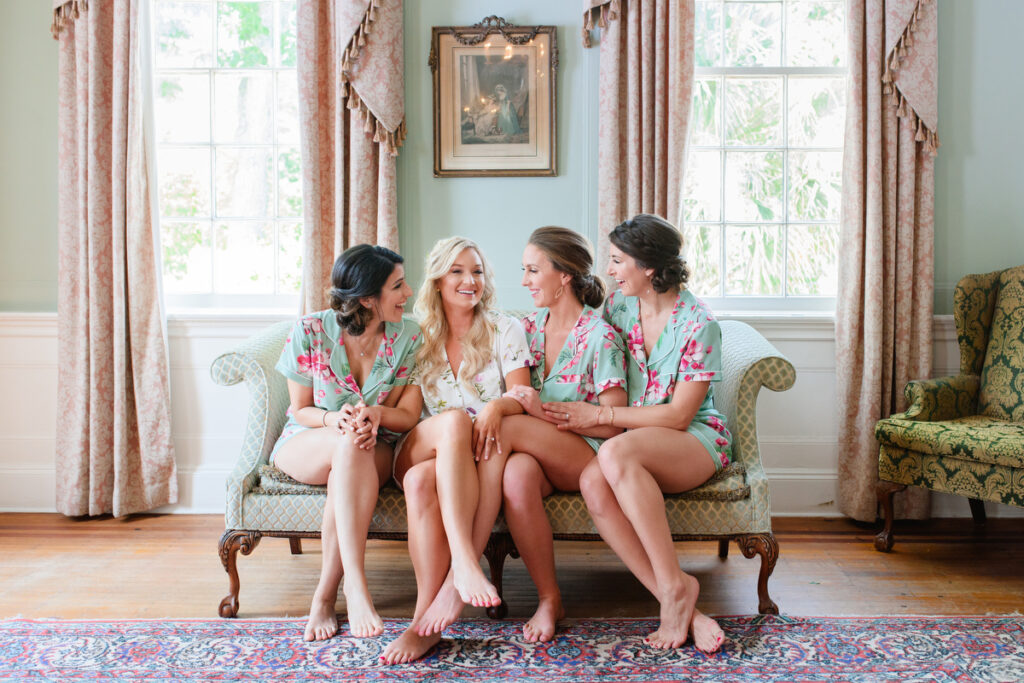 Lowndes Grove wedding bride with bridesmaids laughing