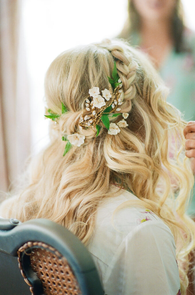 Lowndes Grove bridal hair with gold and floral crown. Boho chic bridal hair with braid