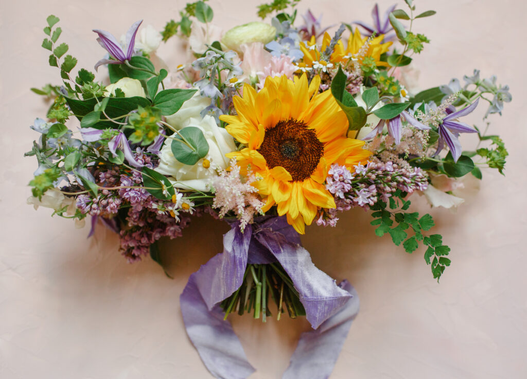 Lowndes Grove wedding bridal bouquet with sunflower and purple flowers