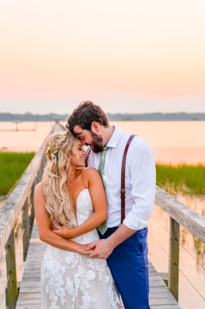 Lowndes Grove sunset photo of bride and groom on pier