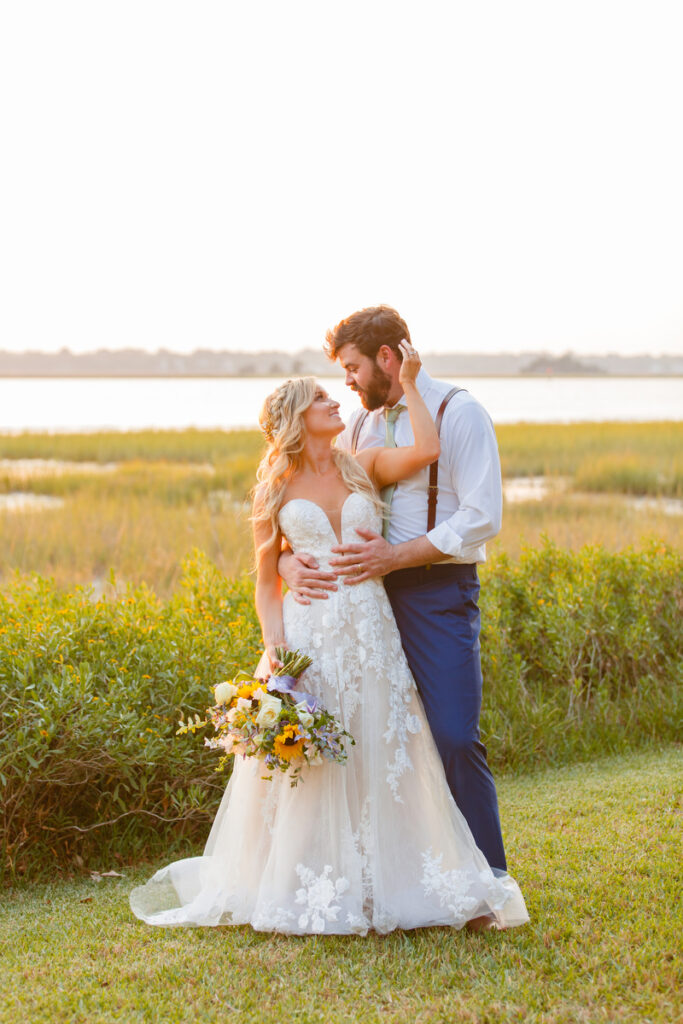 Lowndes Grove wedding bride and groom sunset portrait by the water