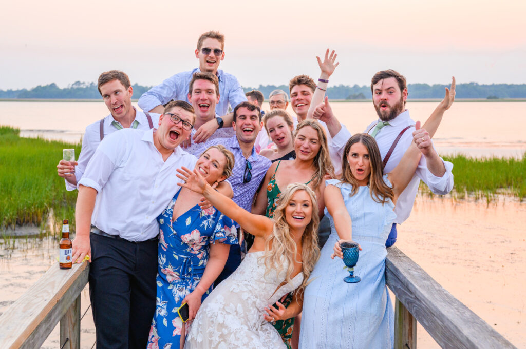 Lowndes Grove wedding bride and groom with friends at reception