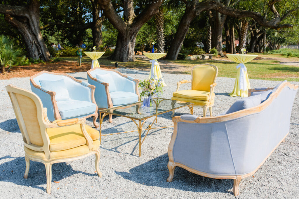 Lowndes Grove wedding reception lounge set with powder blue and yellow chairs