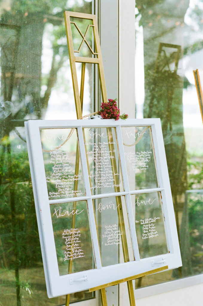 Lowndes Grove wedding custom seating signage on window pane