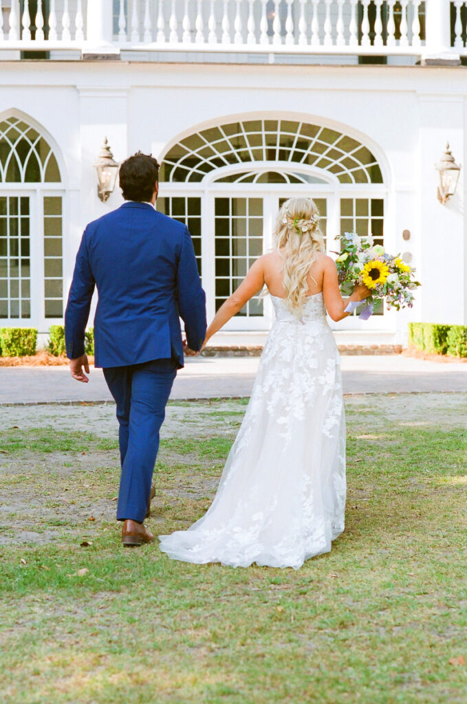 Lowndes Grove wedding bride and groom walking together