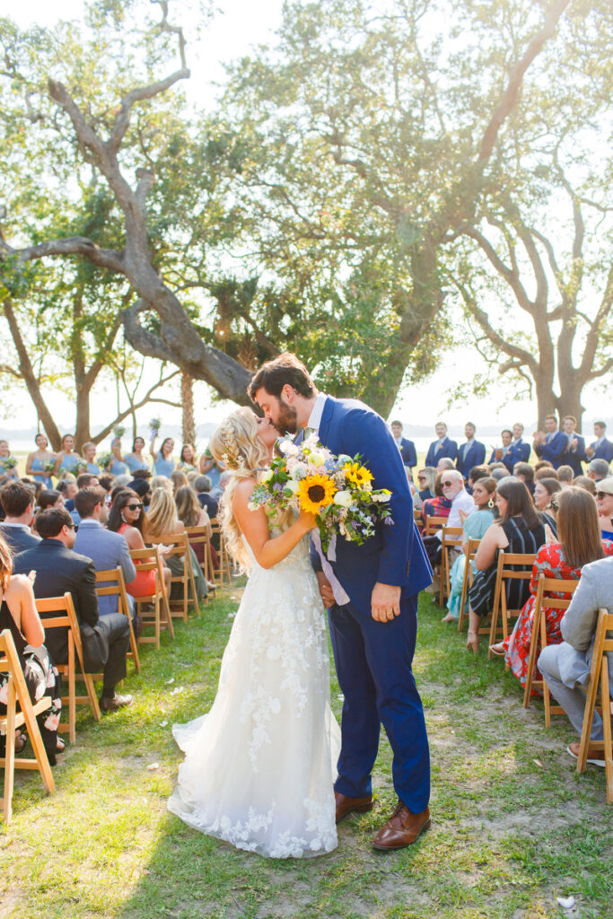 Lowndes Grove ceremony kiss as they walk back up the aisle