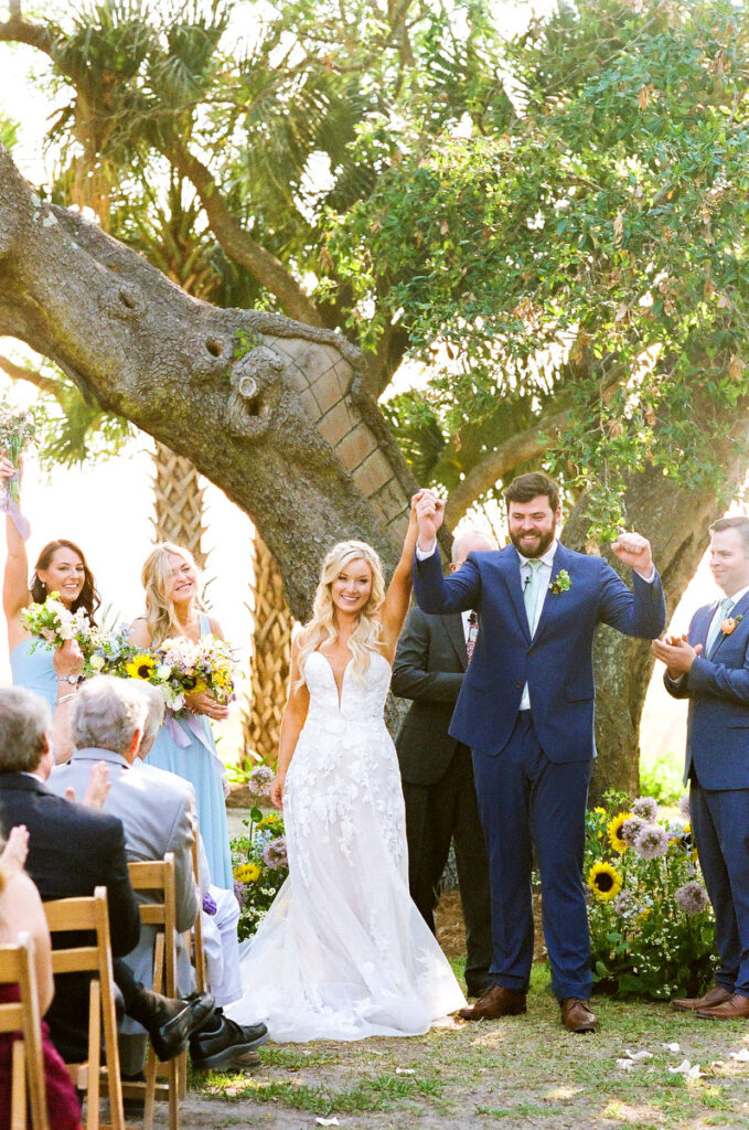 Lowndes Grove wedding bride and groom pump fists in celebration