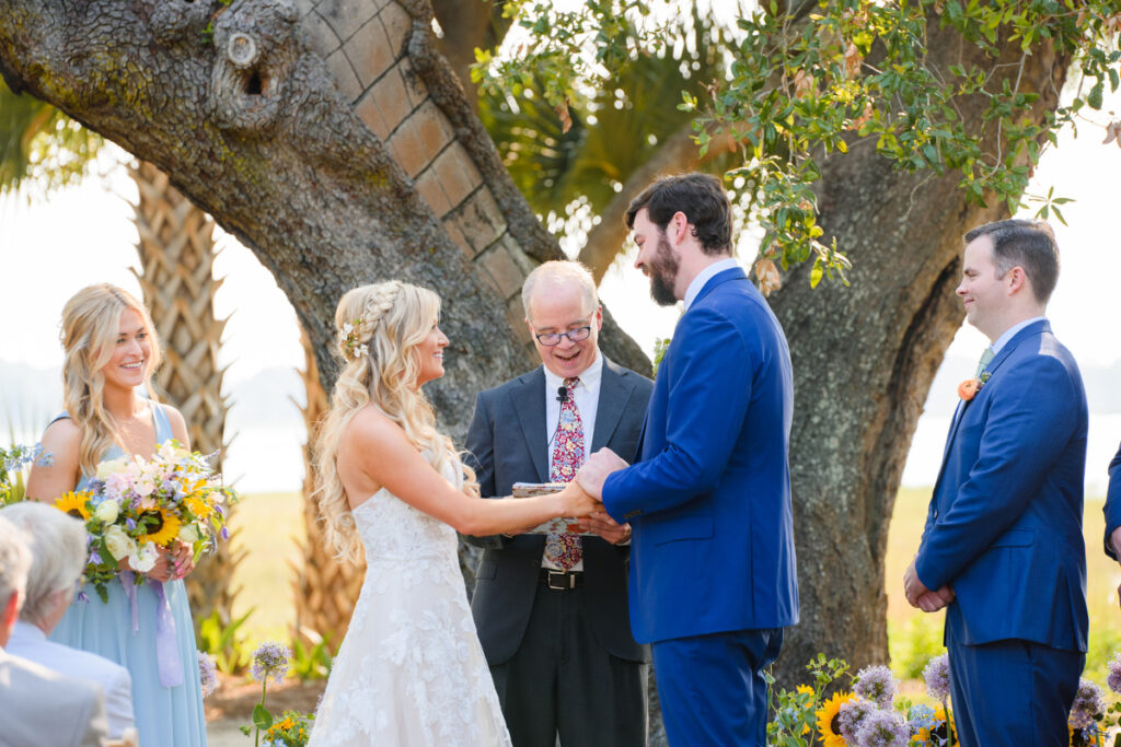 Lowndes Grove wedding bride and groom smiling during wedding ceremony