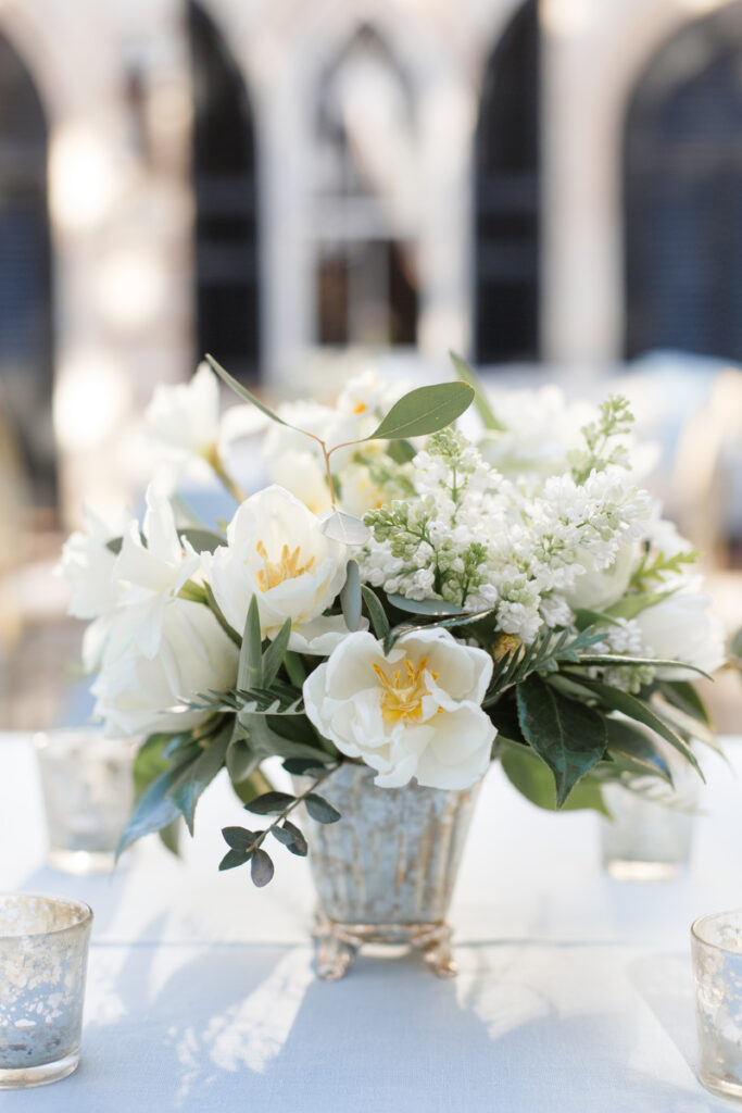 William Aiken House Wedding silver mercury candle holders and vase with all white flower centerpiece