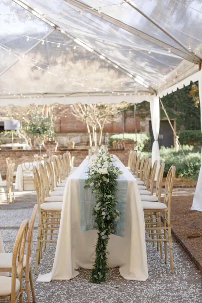 William Aiken House Wedding cascading green and white floral centerpiece at high top table