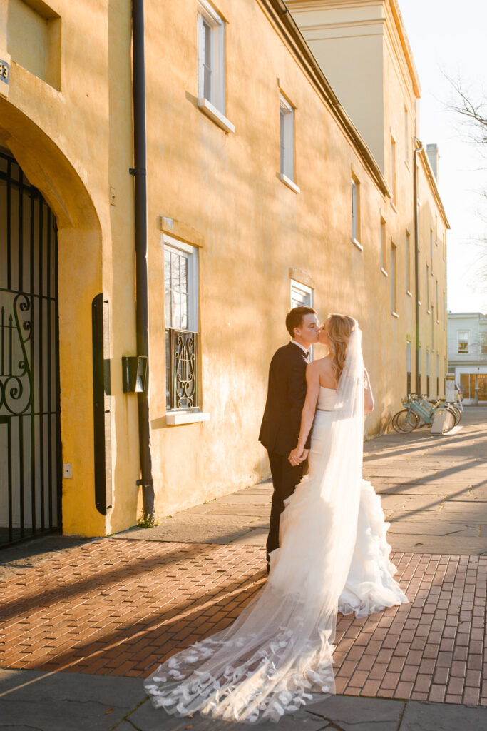 William Aiken House Wedding couple kissing during golden hour