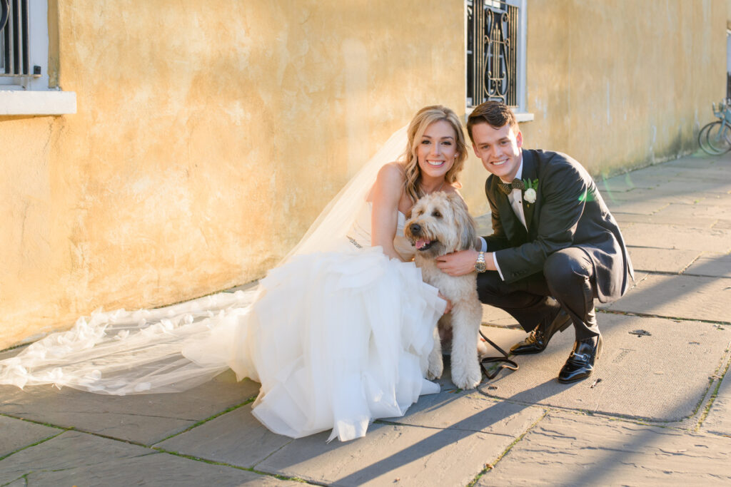 William Aiken House Wedding couple with their golden doodle after ceremony