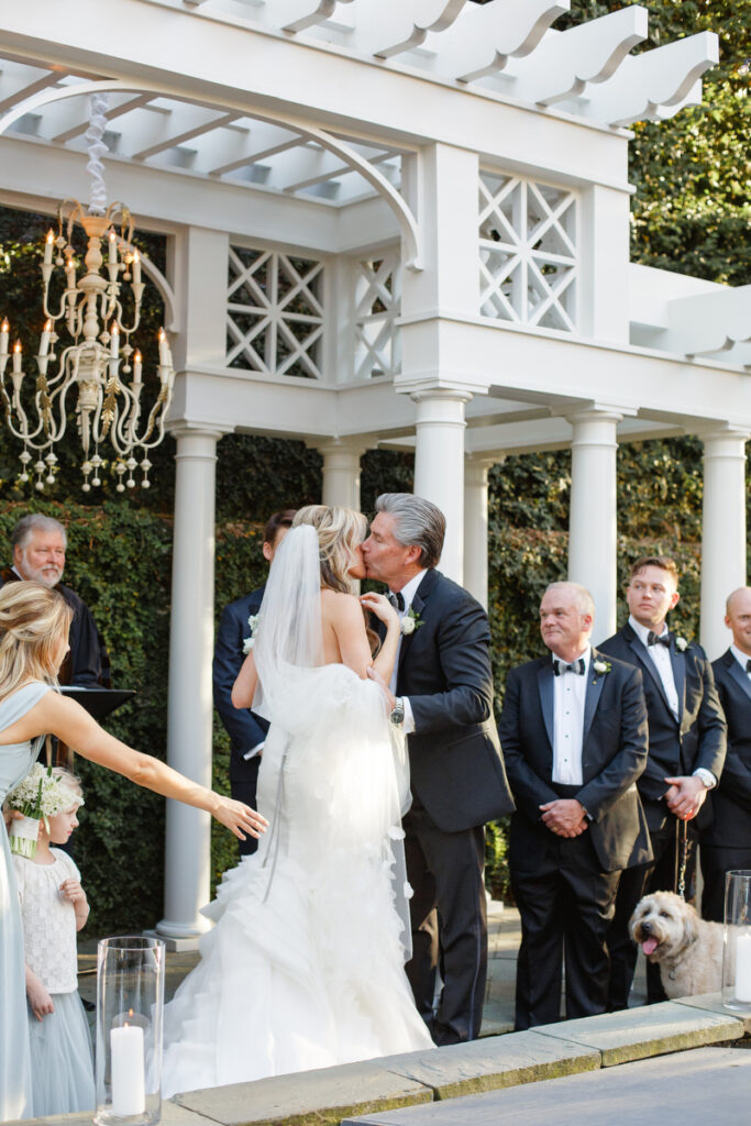 William Aiken House Wedding father of the bride kisses bride's cheek during ceremony