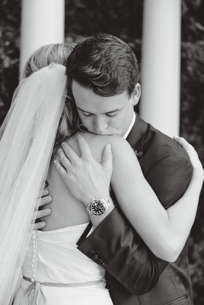 William Aiken House Wedding groom hugging bride