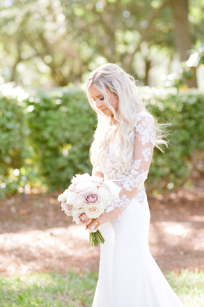 Westin Hilton Head wedding bride looking at bouquet