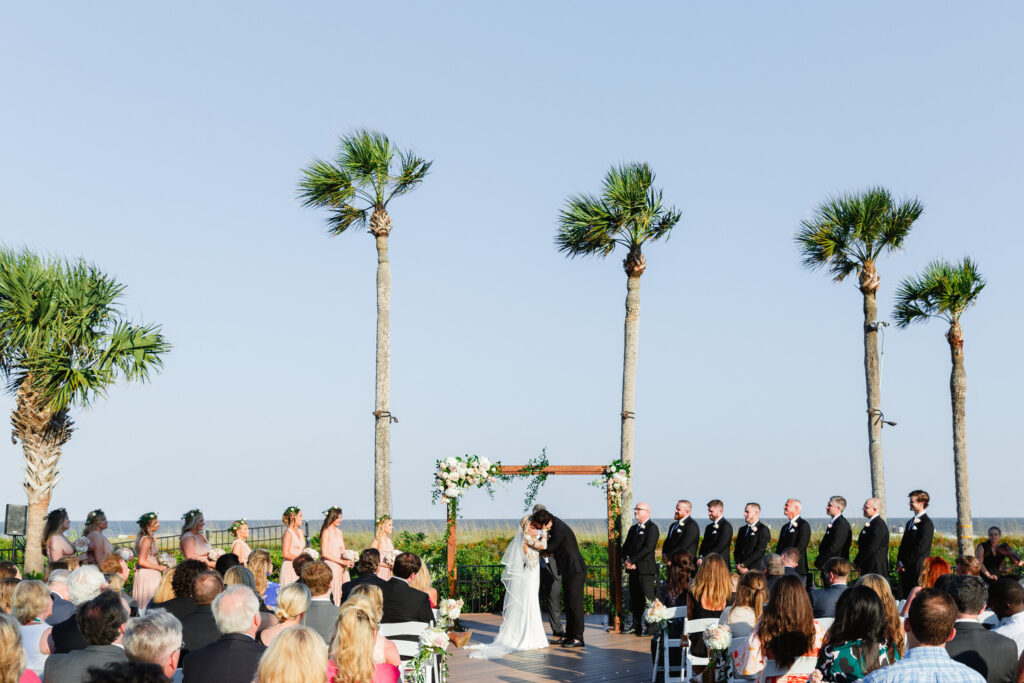 Westin Hilton Head wedding bride and groom kiss at ceremony