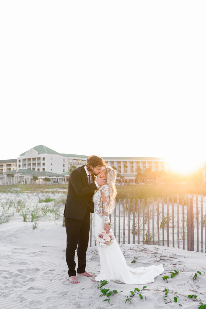 Westin Hilton Head wedding bride and groom kissing during beach sunset