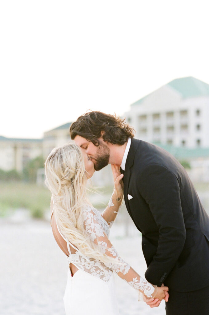 Westin Hilton Head wedding bride and groom kissing on beach