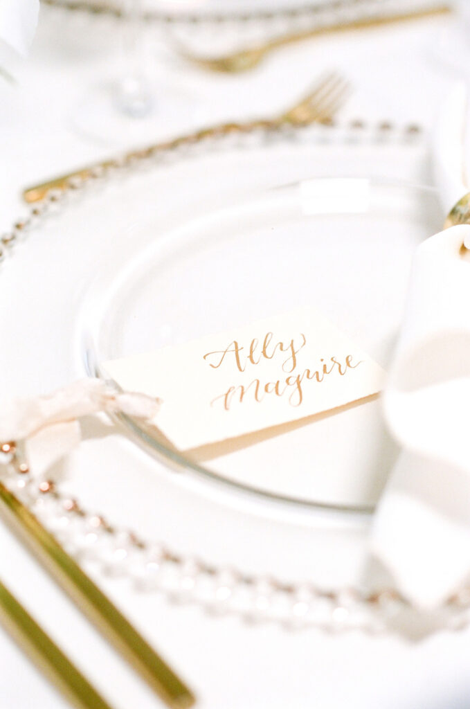 Westin Hilton Head wedding gold calligraphy place cards with mauve ribbon