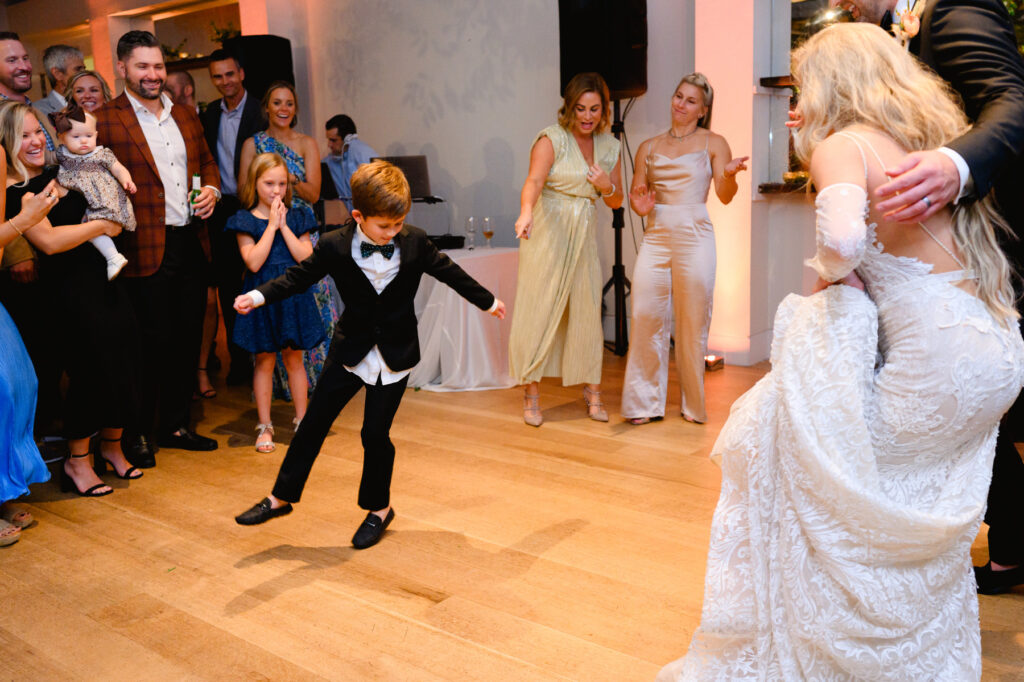 Ring bearer dancing during the reception in the Trolley Room at a Cannon Green Wedding