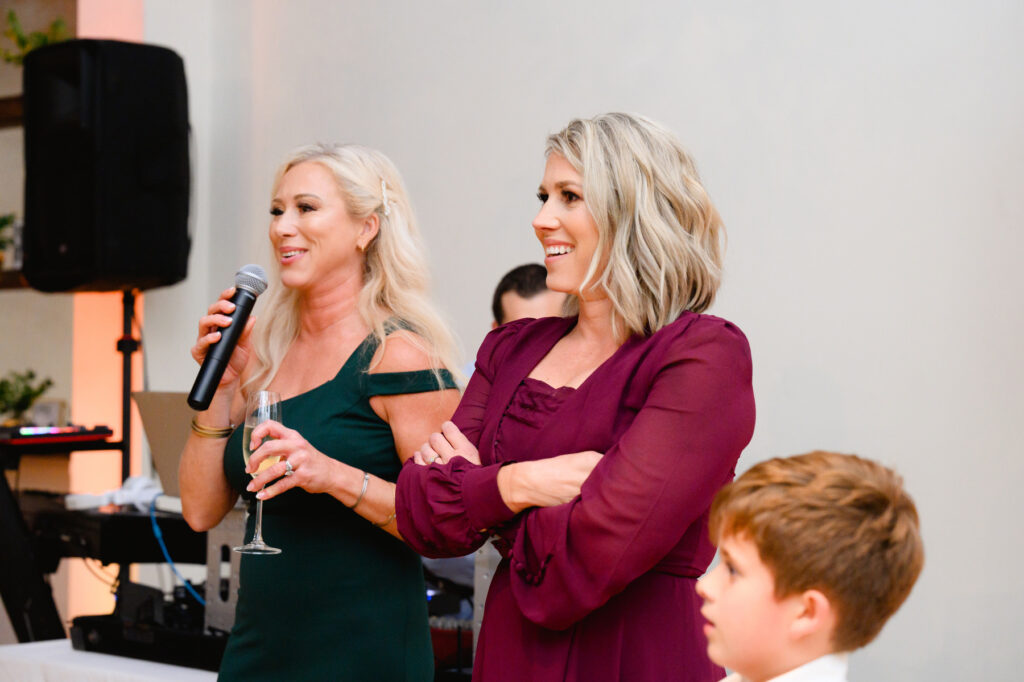 Sisters of bride giving a toast during the reception in the Trolley Room at a Cannon Green Wedding