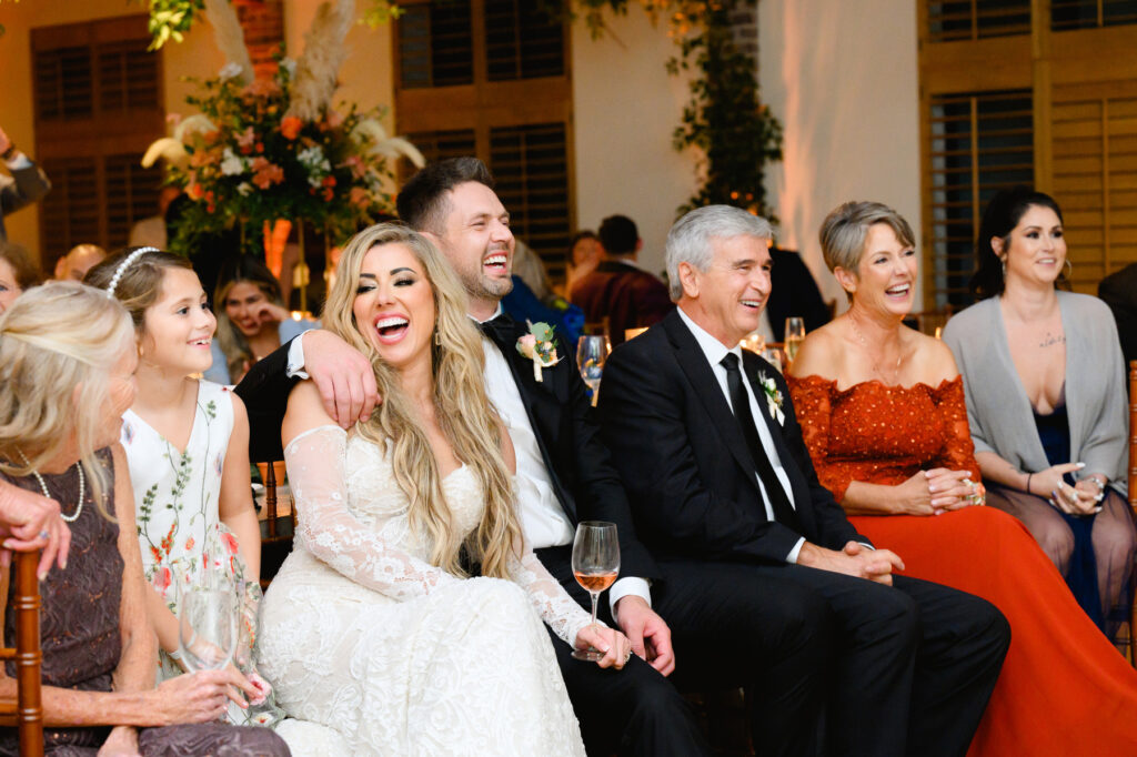 Guests laughing during toasts the reception in the Trolley Room at a Cannon Green Wedding