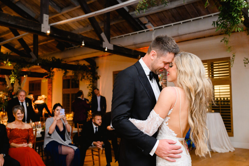 Bride and groom's first dance during the reception in the Trolley Room at a Cannon Green Wedding