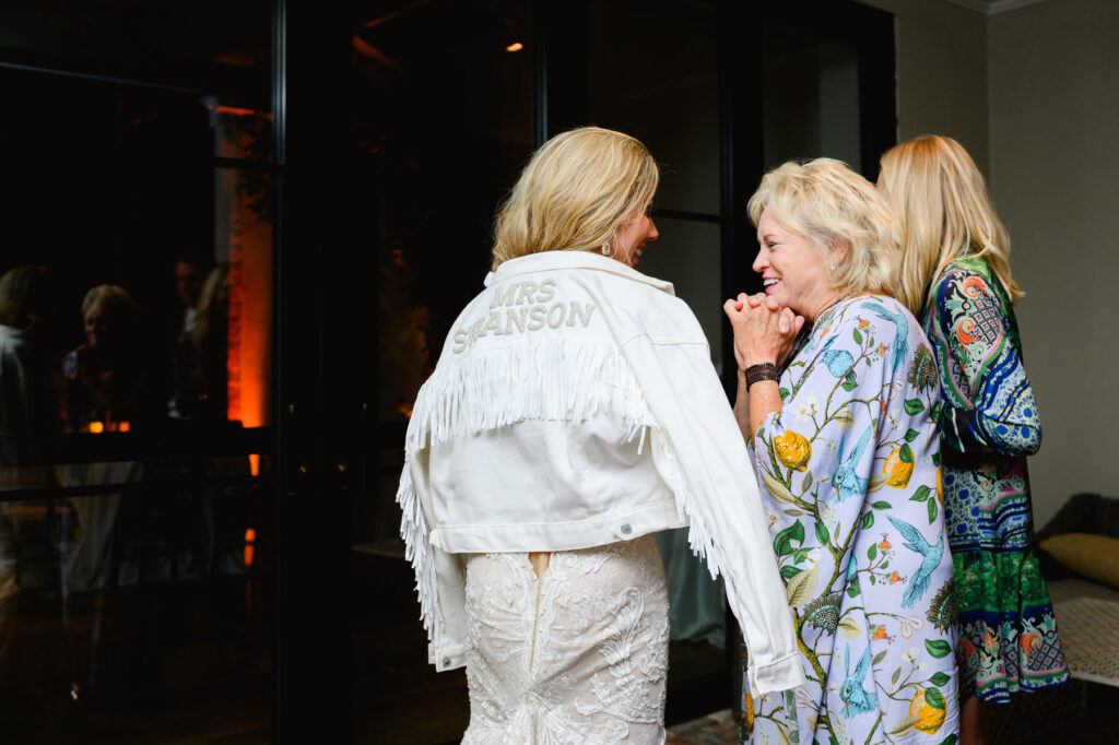 Bride and her aunt talking during the reception in the Trolley Room at a Cannon Green Wedding