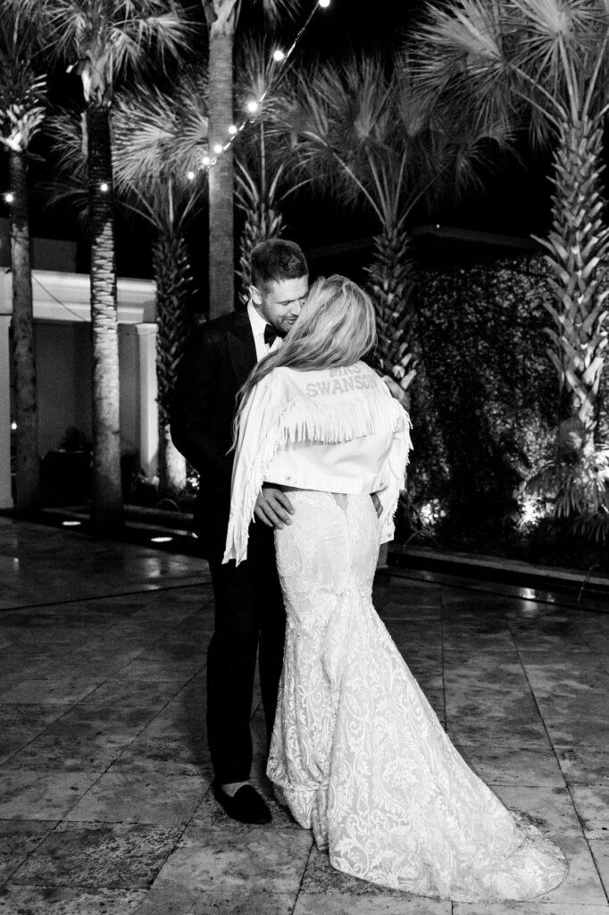 Bride and groom kiss in the courtyard a night at a Cannon Green Wedding