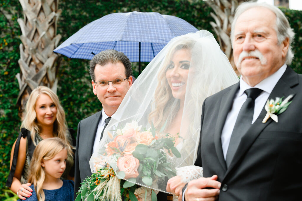 Bride walking down the aisle at Cannon Green Wedding