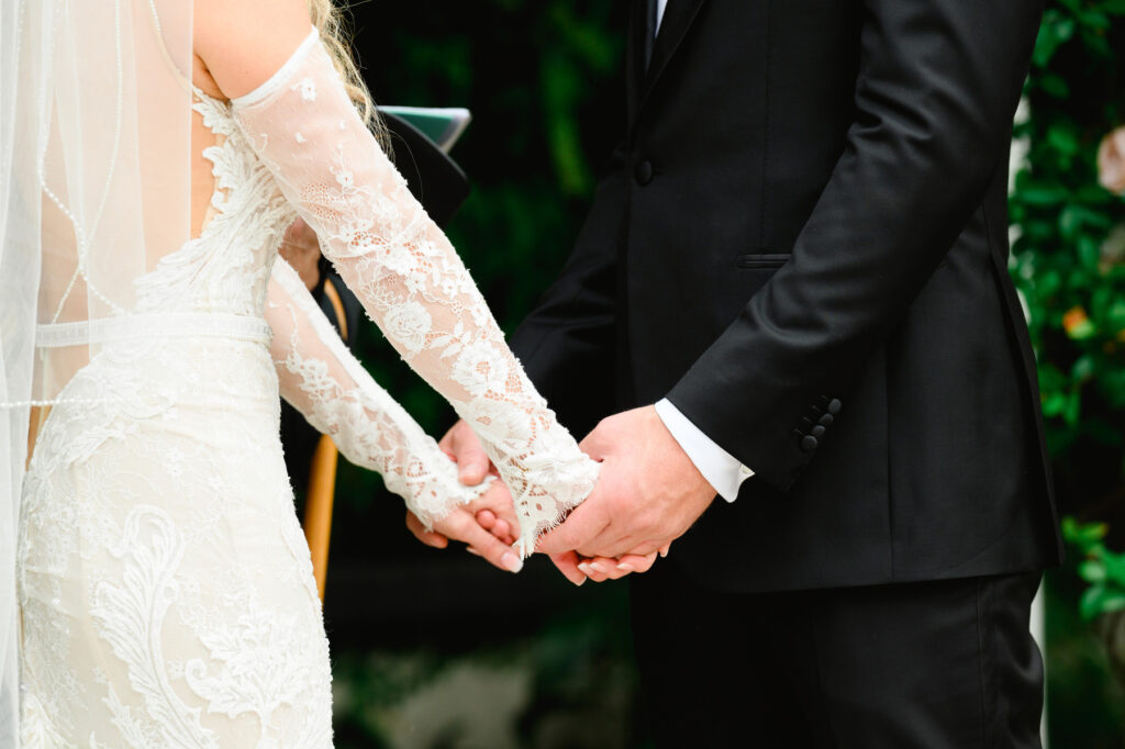 Bride and groom holding hands at a Cannon Green Wedding