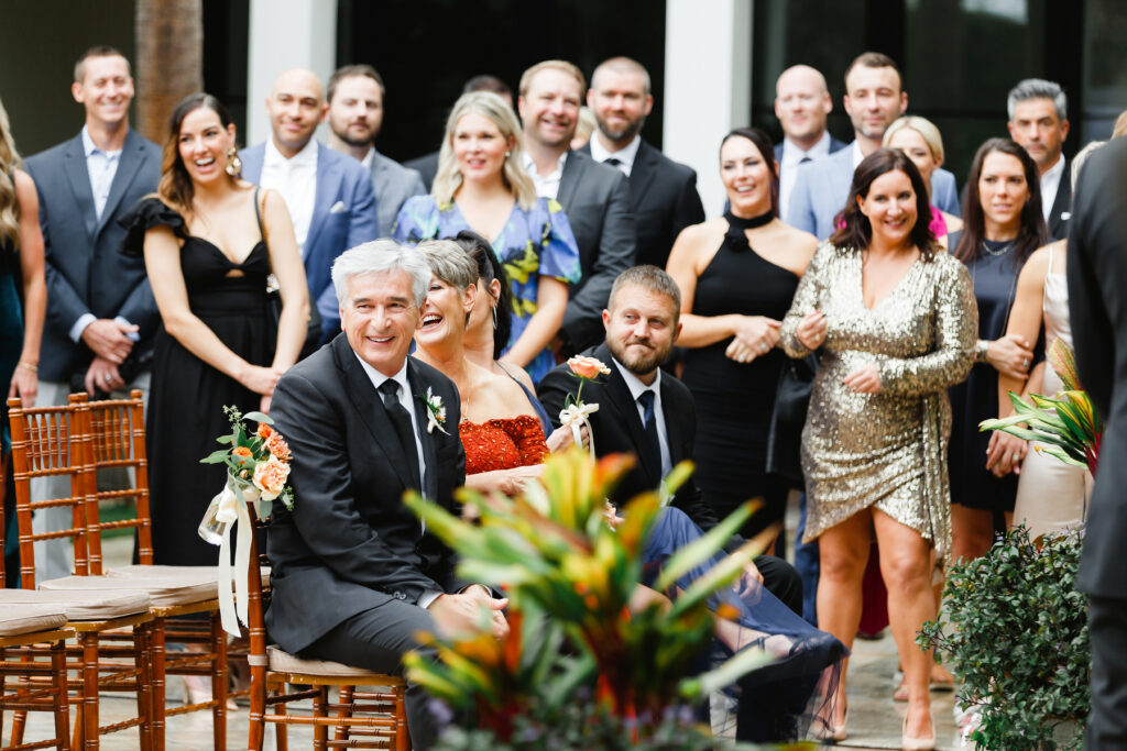 Guests laugh during ceremony at a Cannon Green Wedding