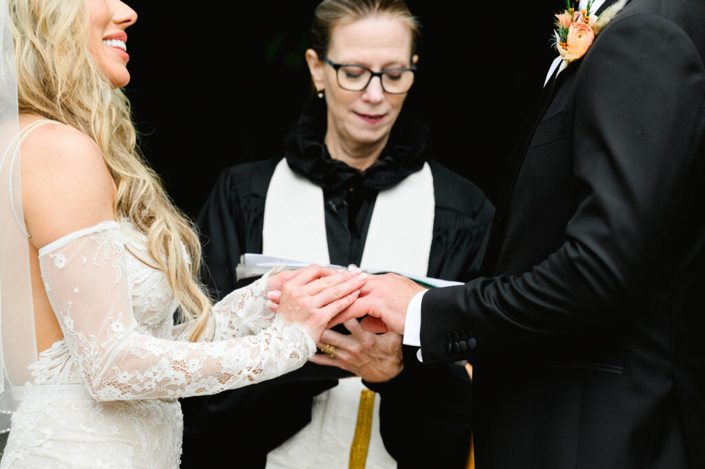 Ring exchange during ceremony at a Cannon Green Wedding