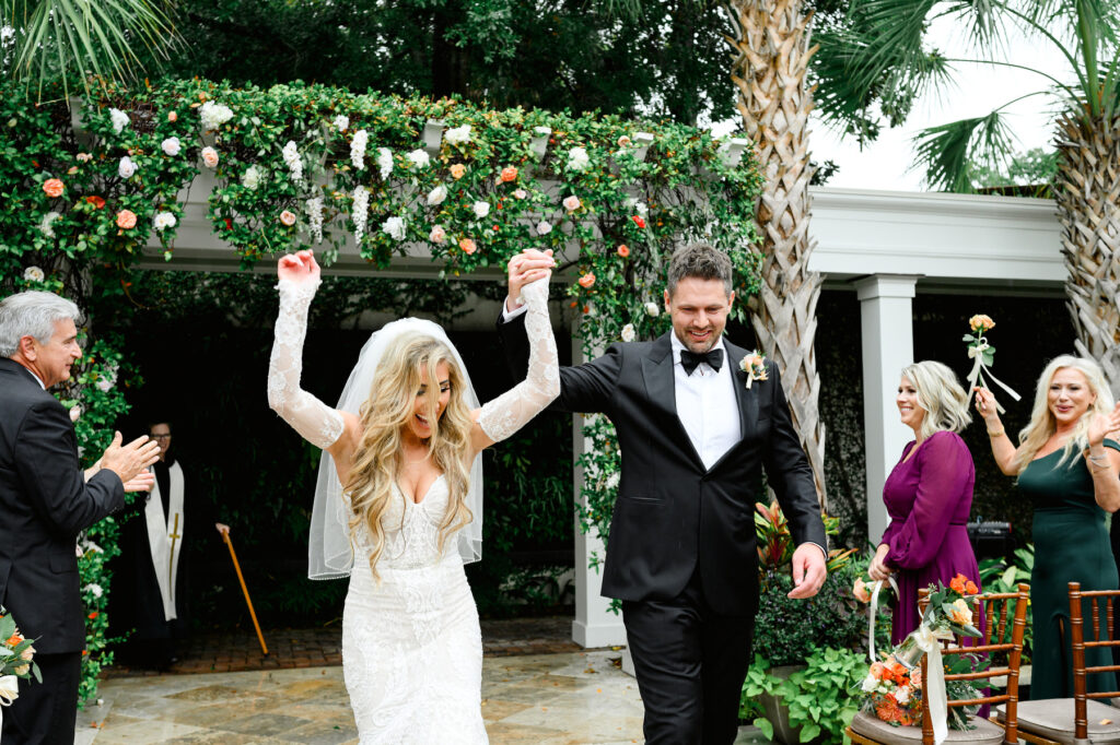 Newlyweds walk up the aisle at the end of the ceremony at a Cannon Green Wedding