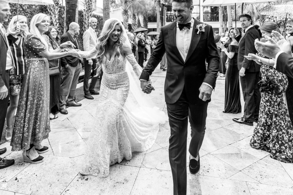 Bride and groom walking by guests after ceremony ends at a Cannon Green Wedding