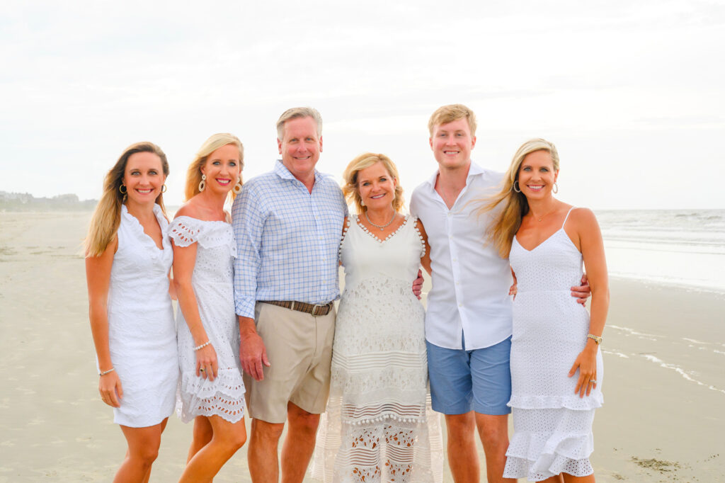 Parents with their adult children during a Kiawah beach family photo