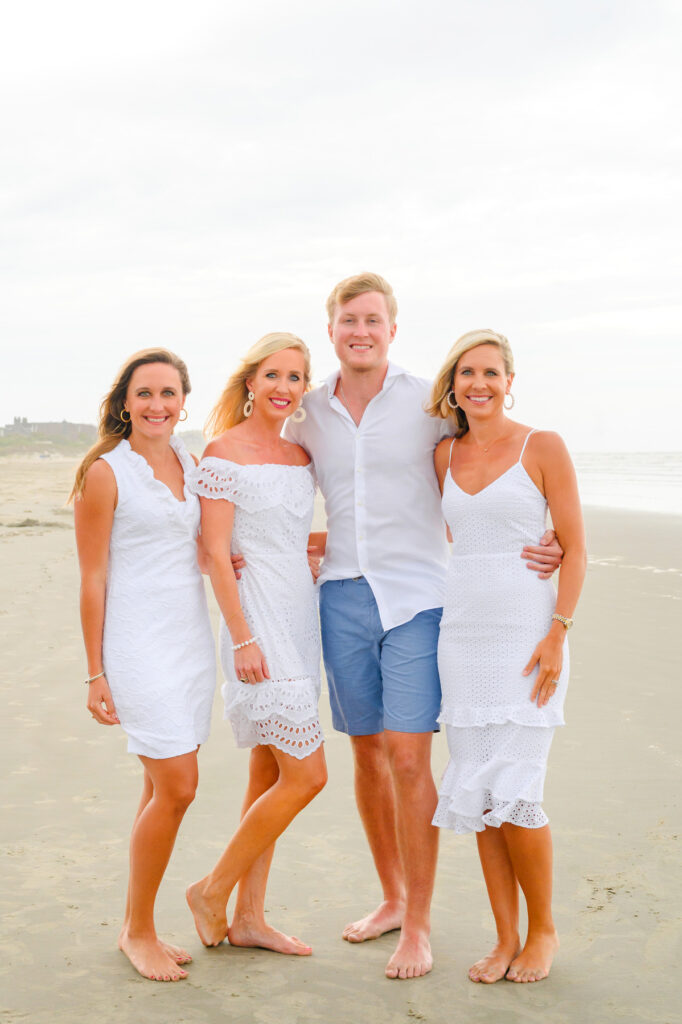 Adult siblings during a Kiawah beach family photo