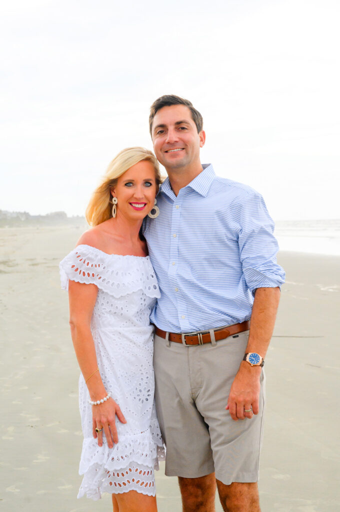 Husband and wife pose together during a Kiawah beach family photo