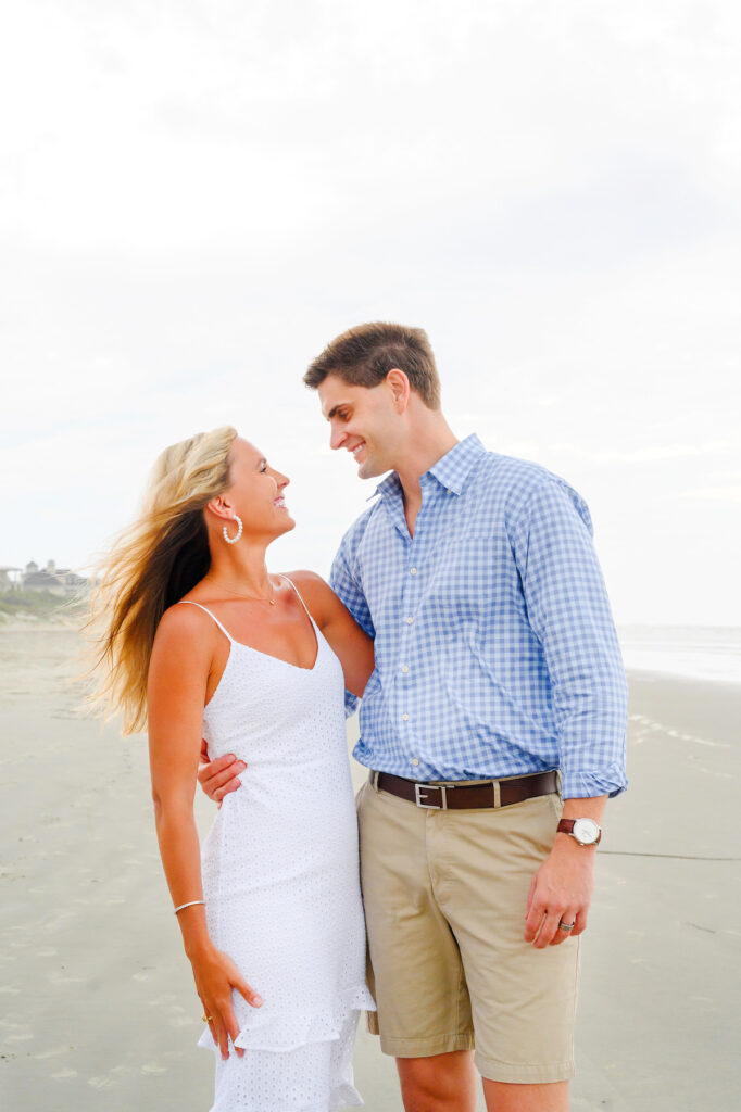 Married couple laughing during a Kiawah beach family photo