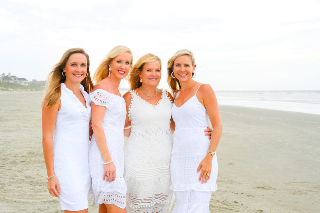 Mother poses with her three daughters during a Kiawah beach family photo