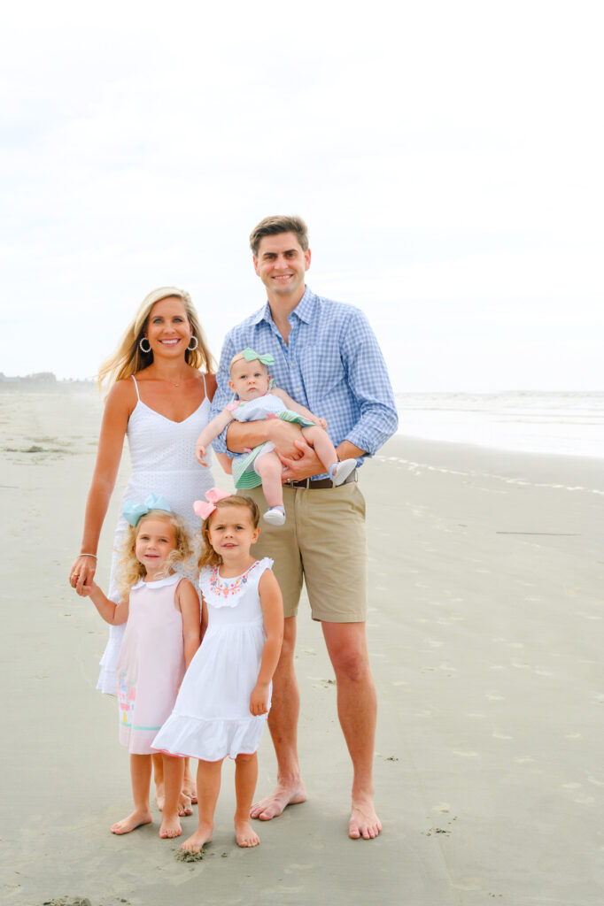 Family of five people posing for a Kiawah beach family photo