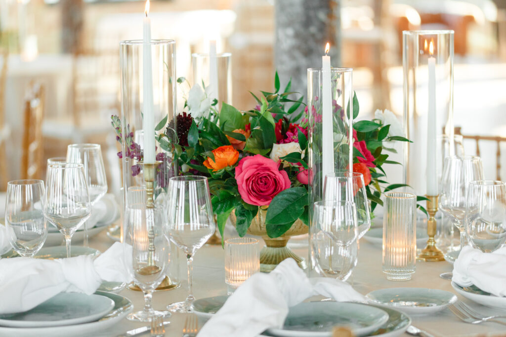 Cedar Room wedding reception floral centerpiece with orange and pink roses