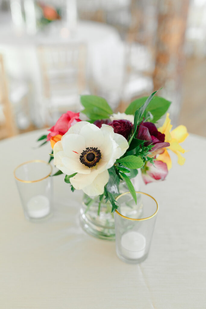 Cedar Room wedding reception floral centerpiece with anemone flower and pink roses