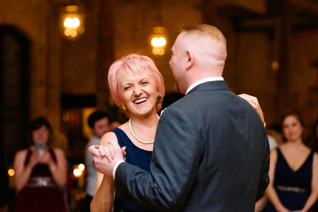 Cedar Room wedding reception with the groom dancing with his mother