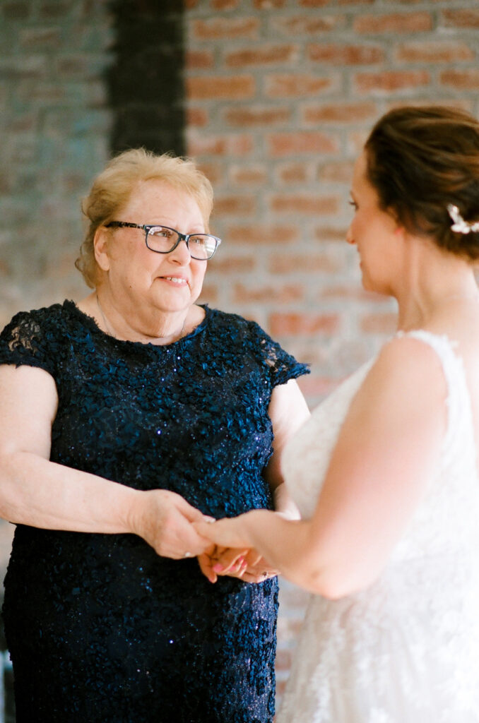 Cedar Room wedding photo of the bride and mother of the bride while getting ready at Planter's Inn