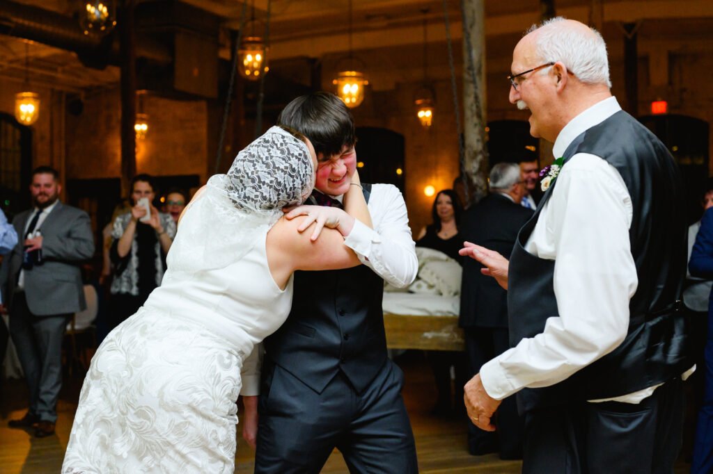 Cedar Room wedding with the bride dancing at reception with her nephew for a traditional Polish bride dance