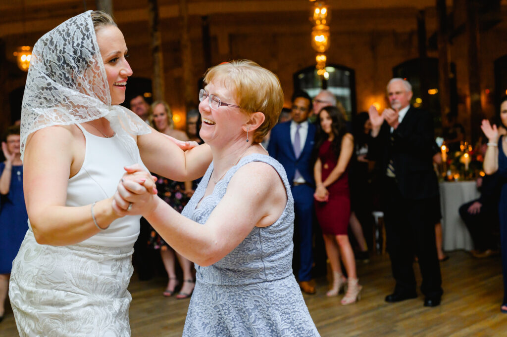 Cedar Room wedding with the bride dancing at reception with a guest for a traditional Polish bride dance